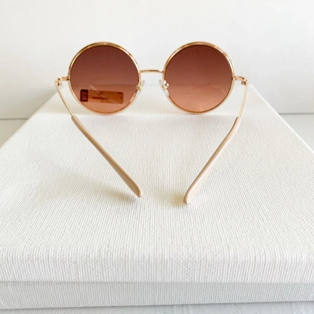 New with tage FGX rose gold round sunglasses